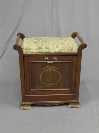 An Edwardian inlaid mahogany box seat piano stool raised on ogee bracket feet