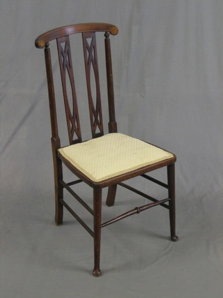 An Edwardian Art Nouveau inlaid mahogany stick and bar back bedroom chair