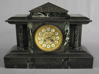 A 19th Century French 8 day striking mantel clock having a gilt and porcelain dial with Arabic numerals, contained in a 2 marble architectural case
