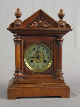 A 19th Century Continental 8 day striking bracket clock with silvered dial  & Arabic numerals contained in a carved mahogany case