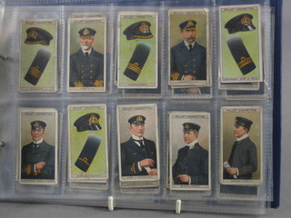 A complete set of Wills Naval Dress and Badges and Wills Merchant Ships of the World cigarette cards