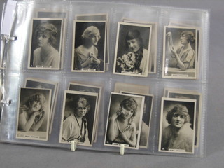 A set of 50 John Players Beauties 1925 cigarette cards 