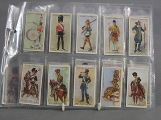 A  set of 50 John Players Regimental Uniforms 1912, with black backs cigarette cards 