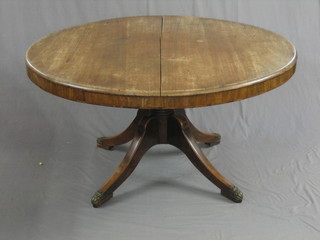 A 19th Century circular mahogany snap top breakfast table, raised on gun barrel, pillar and tripod supports 52"