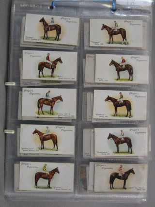 A set of John Players Derby and Grand National Winners 1935, John Players Boy Scouts 1924, Wills University Hoods and Gowns 1926 cigarette cards  