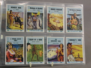 A set of 4 square George Doddy 1959 cigarette cards