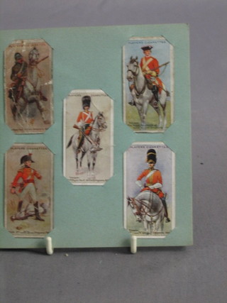 An album of John Players cigarette cards Regimental Uniforms