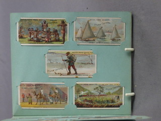 An album of John Players cigarette cards The Empire
