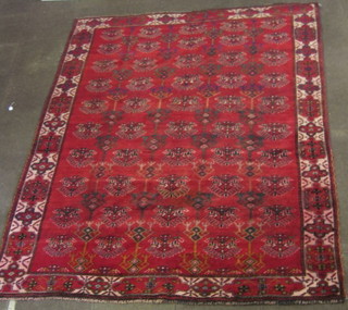 A contemporary red ground Persian rug with geometric all-over design 120" x 91"