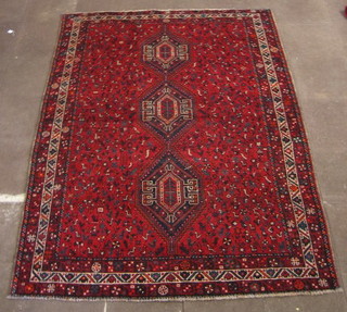 A contemporary red ground Shiraz rug 112" x 82"