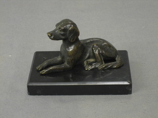 A bronze figure of a seated dog 4", raised on a black marble base