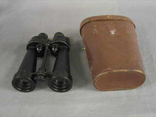 A pair of WWII Naval issue binoculars marked AP900A serial no. 743, complete with leather carrying case 