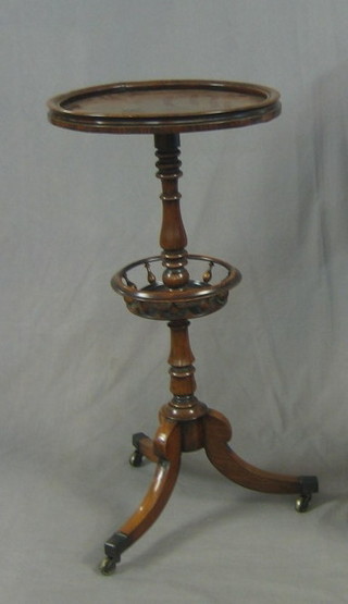 A William IV circular rosewood wine table, the base incorporating a basket and raised on pillar and tripod supports ending in brass caps and castors 16"