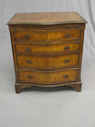 A Queen Anne style figured walnut chest of serpentine outline fitted a brushing slide above 4 long drawers, raised on bracket feet 38"