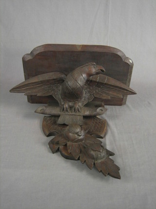 A 19th Century carved oak bracket in the form of an eagle with wings outstretched 20"