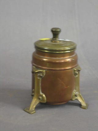 A circular Art Nouveau copper and brass tobacco jar and cover 5"