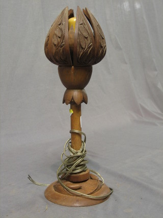 A Burmese carved hardwood table lamp in the form of a flower head