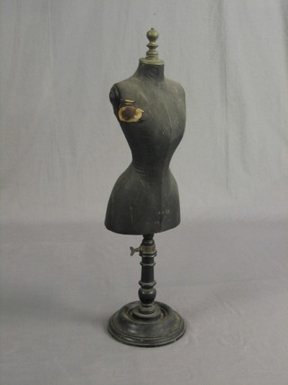 A handsome small Victorian wooden feminine tailor's torso on a turned socle base 26"