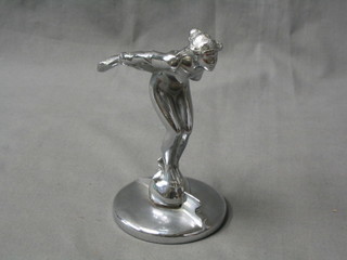 A chromium plated car mascot in the form of a standing lady with arms outstretched 5"