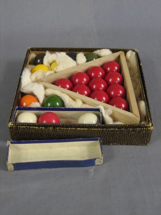 A set of snooker balls complete with triangle