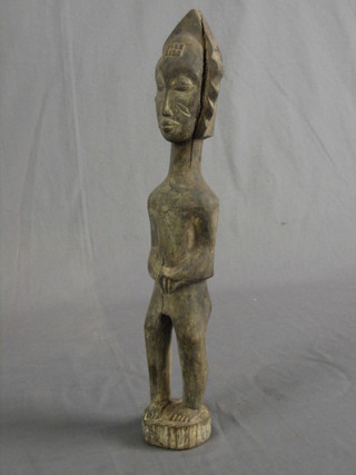 An Eastern carved figure of a standing gentleman 17"