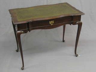 An Edwardian Georgian style rectangular shaped mahogany  writing table with inset green tooled leather writing surface, fitted a frieze drawer and raised on cabriole supports 36"