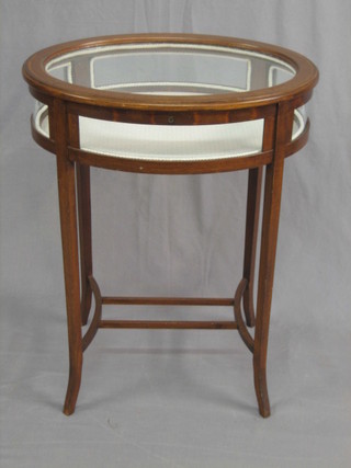 A 20th Century oval inlaid mahogany bijouterie table, raised on splayed feet 22" (no key)