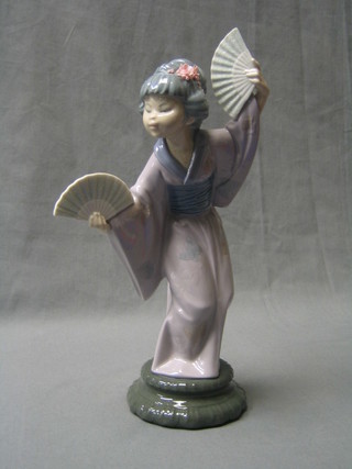 A Lladro figure of  a standing Geisha girl, the base impressed 14 I, 10"