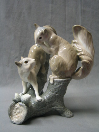 A Nao figure group of 2 squirrels on a branch 10"
