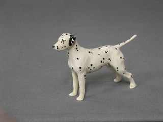 A Beswick figure of a standing Dalmatian, 3" (paw marked 67)