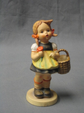 A Goebal figure of a standing girl with basket 5"