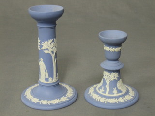 A Wedgwood blue Jasperware candlestick, base marked Wedgwood Made in England 64WH 7" and a do. stub shaped candlestick marked Made in England 67HK 5"