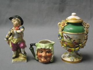 An 18th/19th Century Bloor Derby urn and cover with floral encrusted decoration 4" (f and r), a porcelain figure of a standing boy 4" (f) together with a miniature character jug 2"