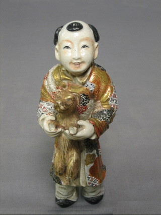 A 19th Century Japanese Satsuma porcelain figure of a standing man with dog 7" (head f and r)