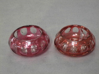 A pair of ruby glass circular salts with panel decoration 2" (1 chipped)