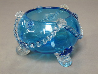 A 19th/20th Century circular blue glass bowl with clear glass swag decoration, raised on 3 clear glass scrolled supports 5"