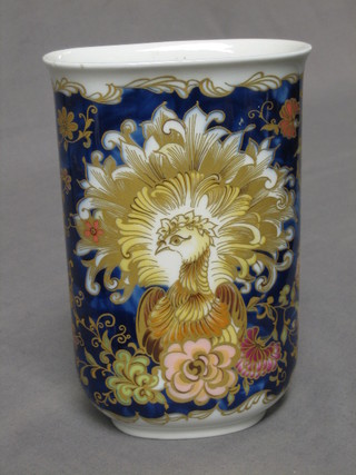 A 20th Century German porcelain vase decorated a peacock 7", the base marked Kaiser