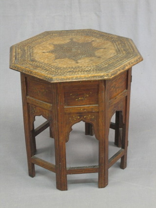 A 19th/20th Century octagonal and inlaid brass occasional table 18", the base with label marked Silver Medal Awarded Mistral Dhani Ram & Puran Chand