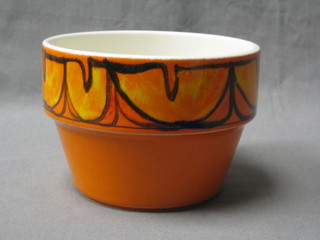 A Poole Pottery atomic orange jardiniere, the base marked R, 6"