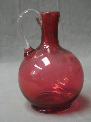 A Victorian cranberry glass ewer with clear glass stem 8" (spout f)
