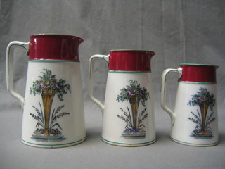 3 Victorian Wedgwood graduated purple and green banded jugs with floral decoration