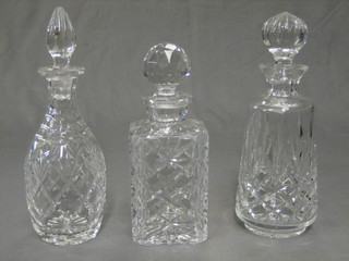 A cut glass spirit decanter and stopper and 2 club shaped decanters and stoppers