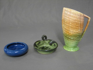 A Sylvac style green glazed vase, base marked 1418 Made in England 8", a circular green glazed Brannam ashtray 4" and a Cockington green glazed pottery dish 5"