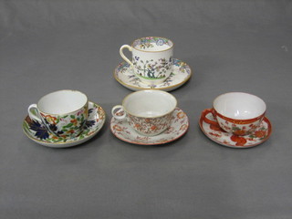 A Derby style cup and saucer, a Minton cup and saucer and 2 others