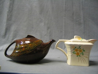 An Art Deco T-Flo brown glazed teapot, together with an Art Deco Clews pottery teapot with floral decoration