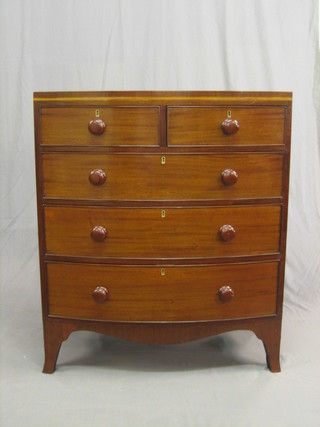A 20th Century Georgian style mahogany bow front chest of 2 short and 3 long drawers with tore handles, raised on splayed feet 36"