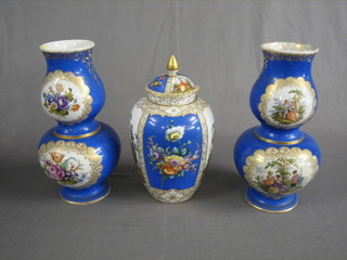 A 20th Century garniture of 2 matching porcelain gourd shaped vases 14" and 1 other urn and cover 11" (urn lid f and r)