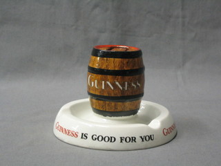 A Mintons Guinness advertising ashtray incorporating a match stand in the form of a barrel of Guinness, the base marked Guinness is good for you, the under side marked GA/A/254 RD 778941