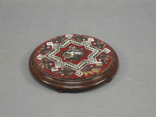 A Victorian circular mahogany and bead work teapot stand/footstool, 13"
