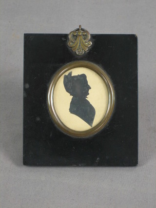A Victorian head and shoulders silhouette of a lady 2" contained in an oak frame